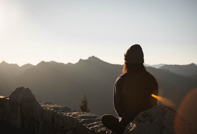 A person reflecting quietly in a calm therapy setting