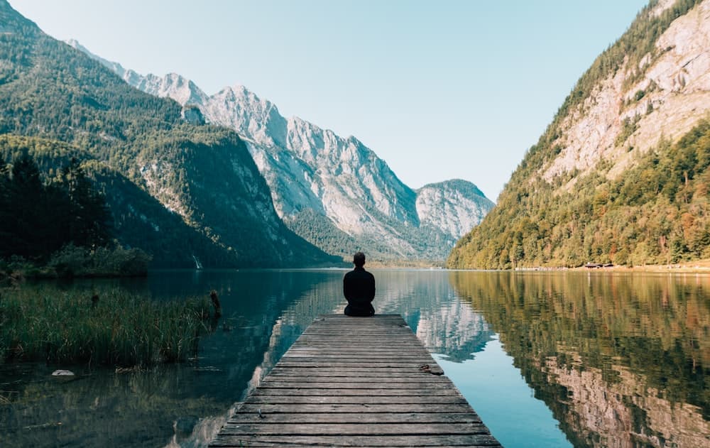 A quiet lake dock at rest, reflecting the calm you can expect from your first visit